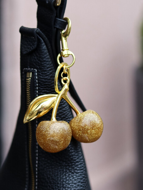 CHERRY BAG CHARM DARK GOLD GLITTER